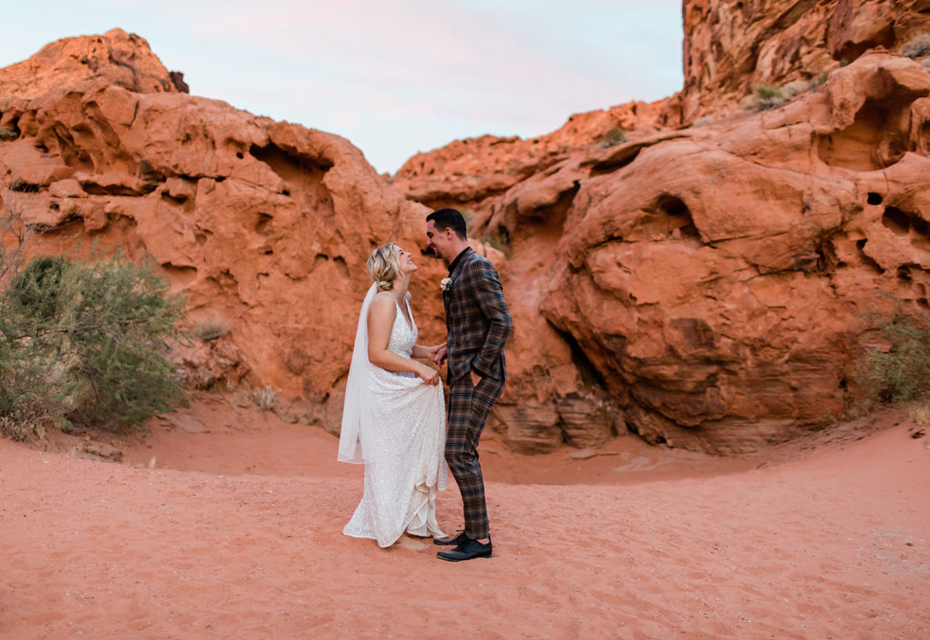 bride and groom dancing on the sand at Valley of Fire