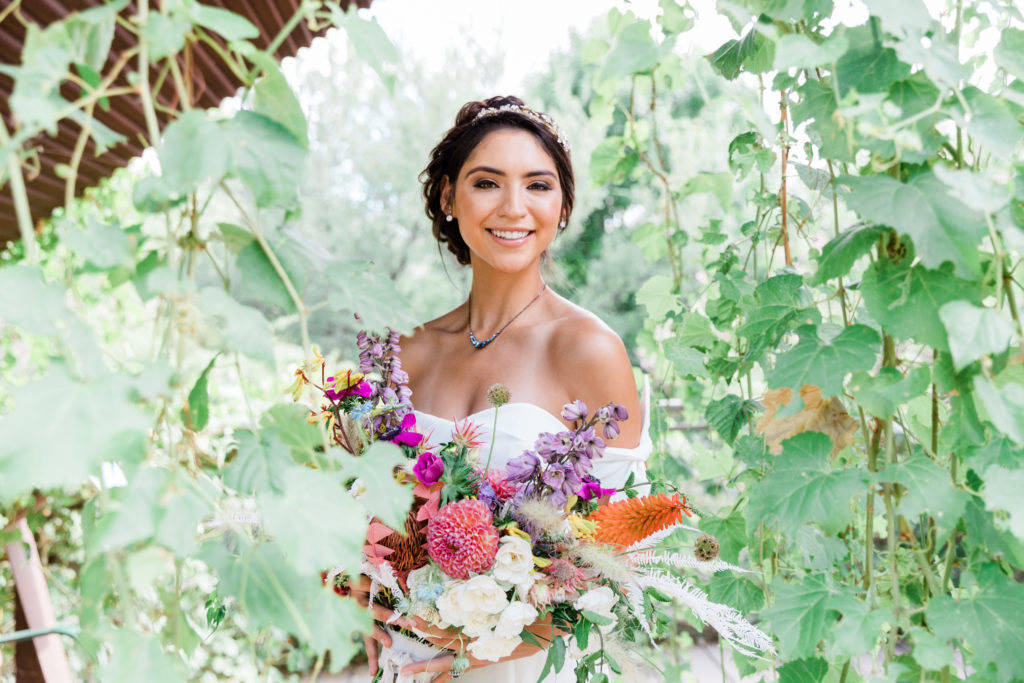 Bride holding her colorful bouquet at her Springs Preserve wedding in Las Vegas