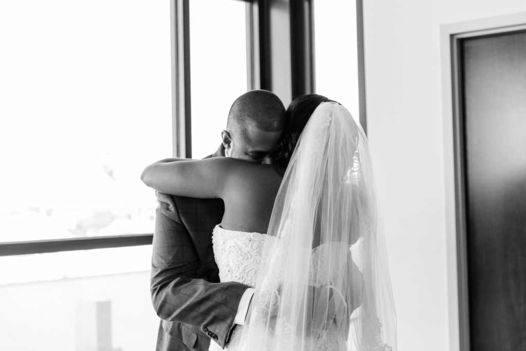 groom hugging his bride during their 1st look on their wedding day